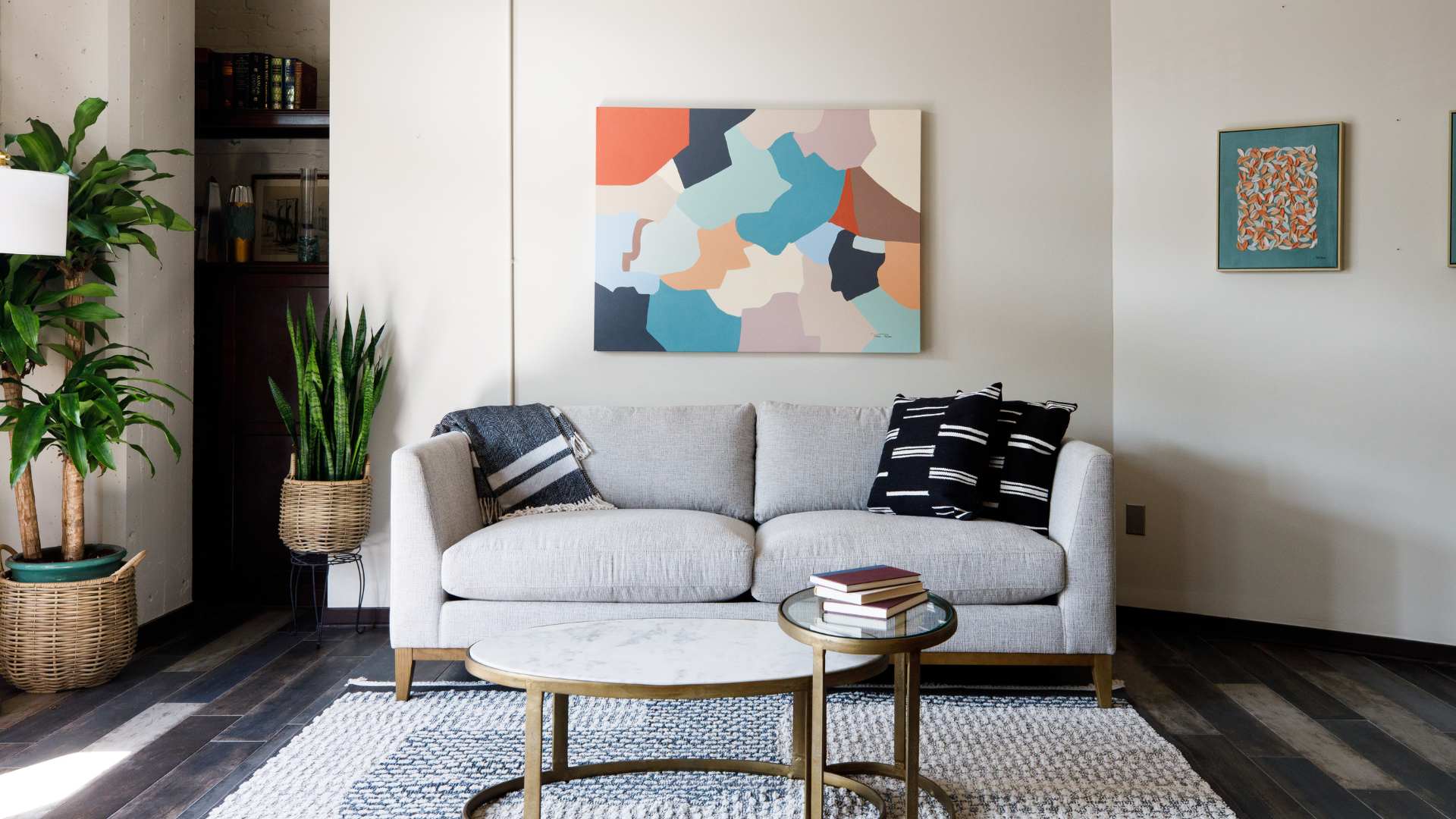a white sofa rental with. a coffee table